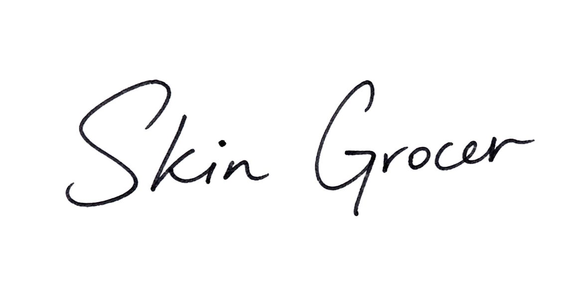 Handwritten signature from the Skin Grocer team