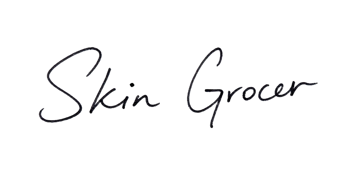 Handwritten signature from the Skin Grocer team